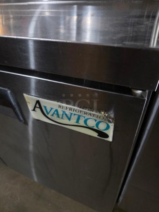 Avantco 47" 2 Door Refrigerated Sandwich Prep Table, model 178APT48HC, visible dents, Avantco logo on door.