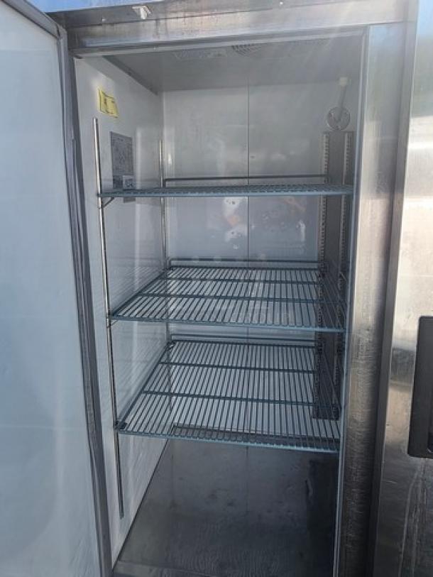 Avantco A-49F-HC 54" solid door reach-in freezer; three wire shelves, stainless steel exterior, clean condition.