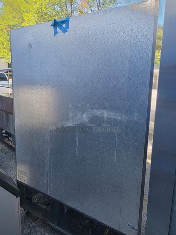 Avantco A-49F-HC 54" solid door reach-in freezer, stainless steel exterior, used condition, scuff marks visible.