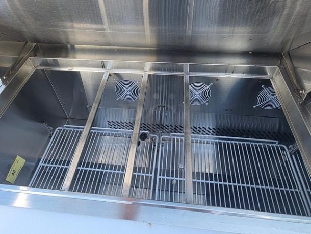 Migali C-SP72-30BT-HC salad prep table, stainless steel, overhead shelf, clean interior, visible cooling fans.