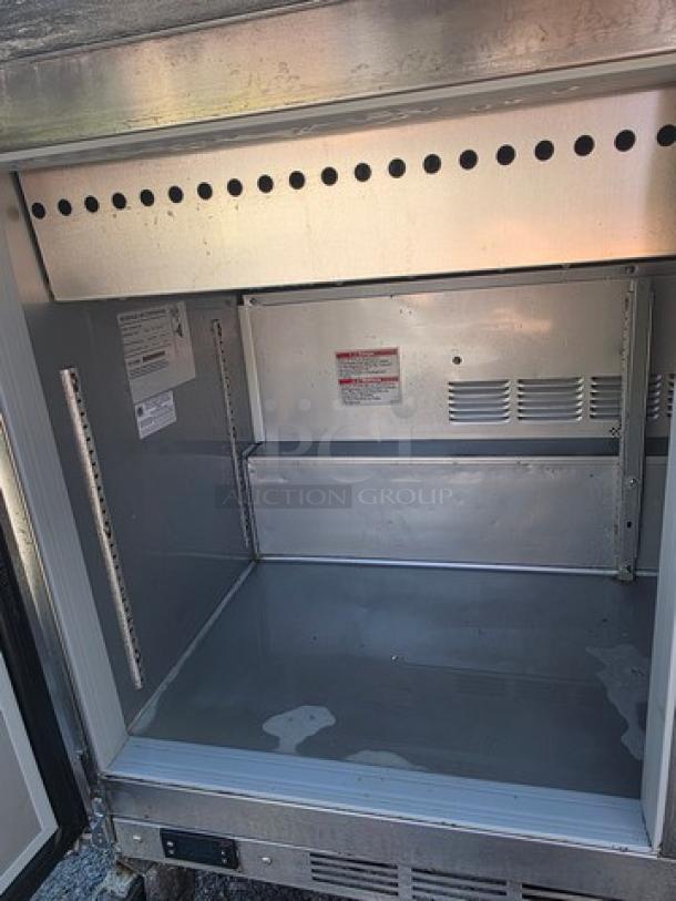 Beverage-Air SPE48HC-18M Mega-Top Sandwich Prep Table, stainless steel interior, spacious section for ingredients.