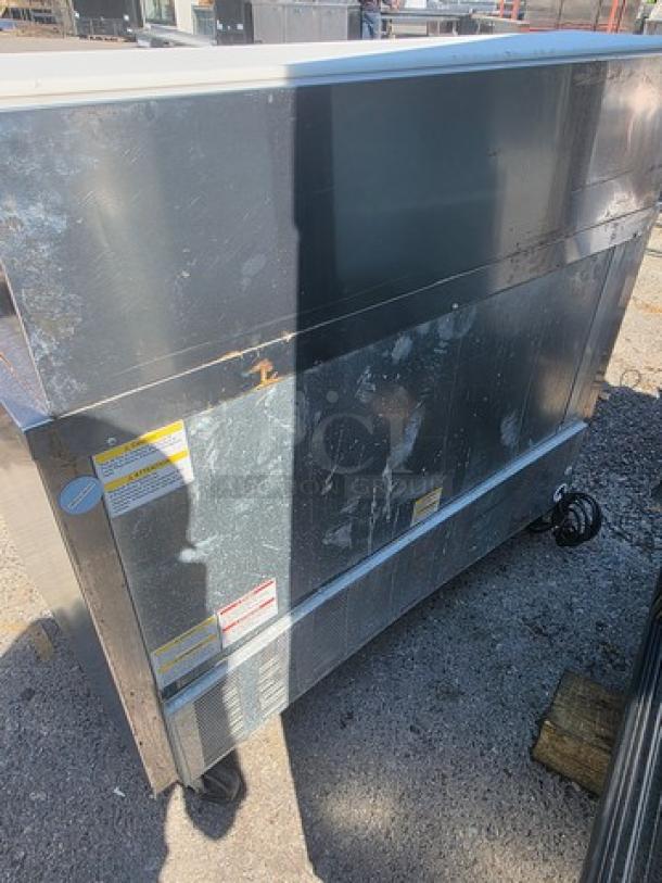 Beverage-Air SPE48HC-18M Mega-Top Sandwich Prep Table, stainless steel, visible wear, model and safety labels present.
