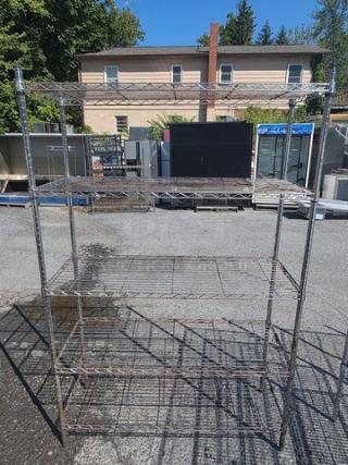 5-tier wire shelf, metallic frame, used condition. Adjustable shelving, suitable for storage or garage use. No visible tags.