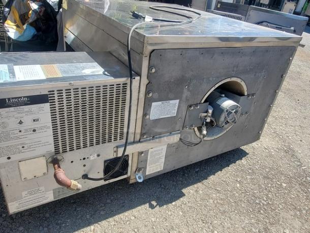 Lincoln Impinger 1450 Pizza Conveyor Oven, stainless steel, 120 VAC, natural gas, 70K-120K BTU, in used condition.