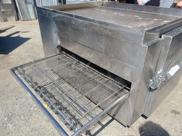 Lincoln Impinger 1450 Pizza Conveyor Oven, stainless steel, natural gas, used condition, featuring conveyor belt system.