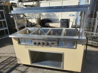 Colorpoint 5E4-CPA-EB electric steam table with four wells, control knobs, and metal frame. Good condition; 208V, 1PH, 60Hz.