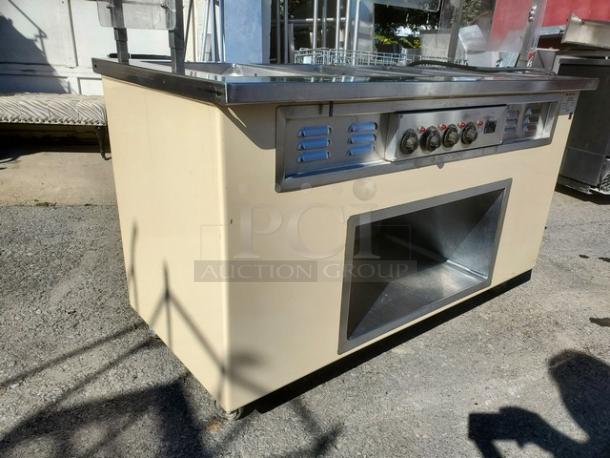 Colorpoint 5E4-CPA-EB electric steam table, 4-well, 208V, 1 PH, 60 Hz, stainless steel, controls visible, good condition.
