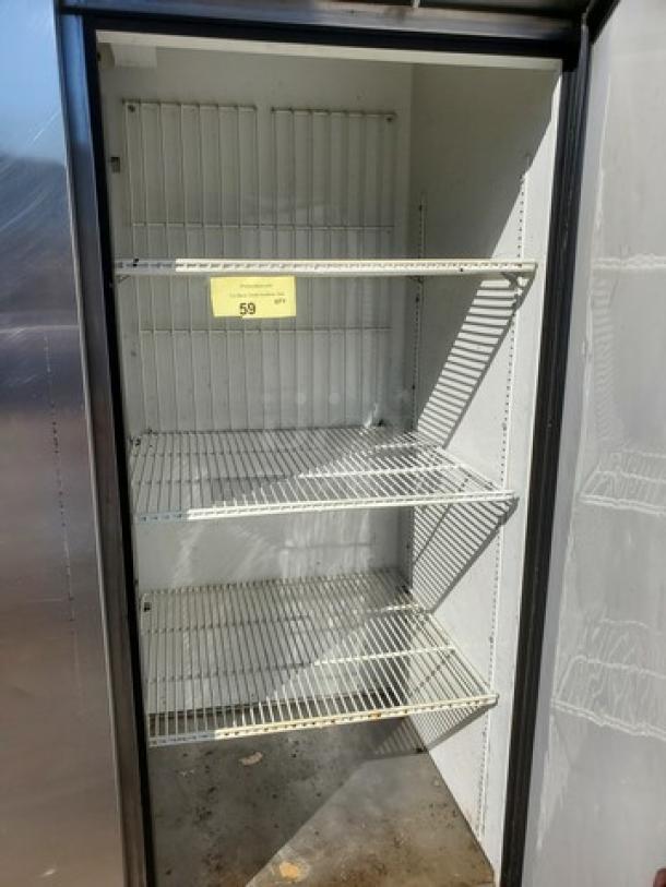 True T-72F reach-in freezer, 3 sections, solid doors, metal shelves, used condition, interior label shows number 59.