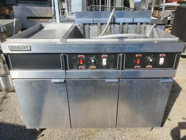 Hobart 3HFD50 electric fryer with 2 wells and 1 dump station, 208V, 3PH, 60 Hz. Stainless steel. Used condition.