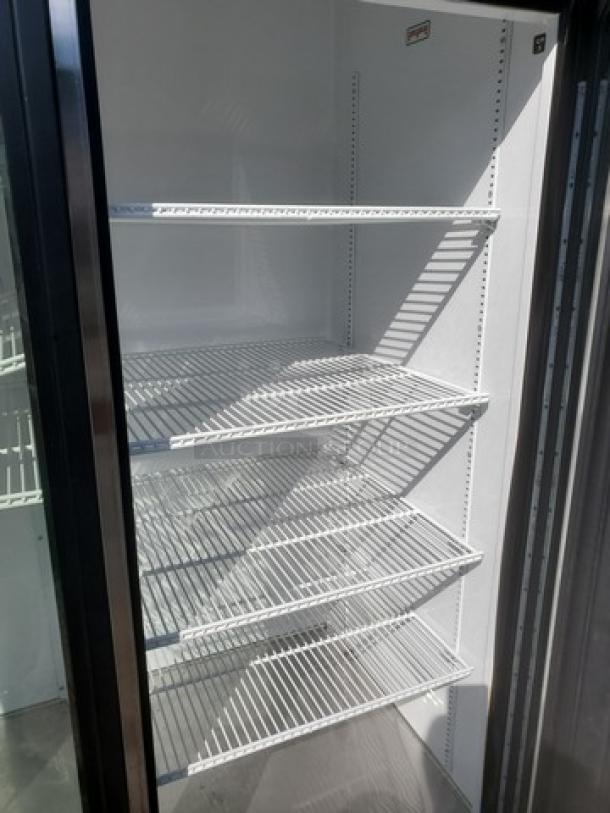 True GDM-72-HC-TSL01 three-section glass door merchandiser with wire shelves. Excellent condition, 115V, 60 Hz, 1PH.