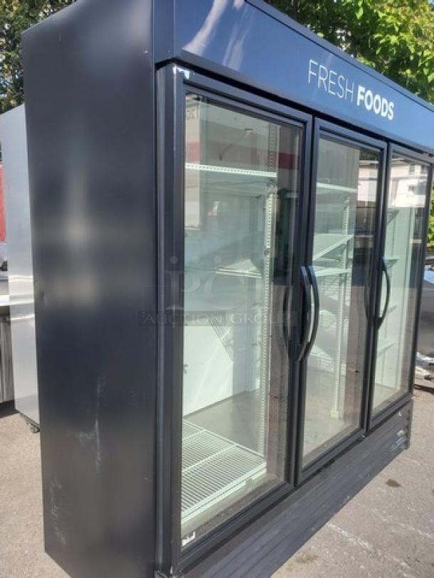 True GDM-72-HC-TSL01 78" three-section glass door merchandiser, 115V, in good condition, featuring "Fresh Foods" display label.