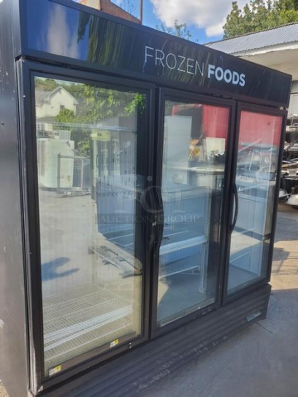 True GDM-72F-HC-TSL01 78" 3-section glass-door merchandiser freezer, black exterior, labeled "Frozen Foods."