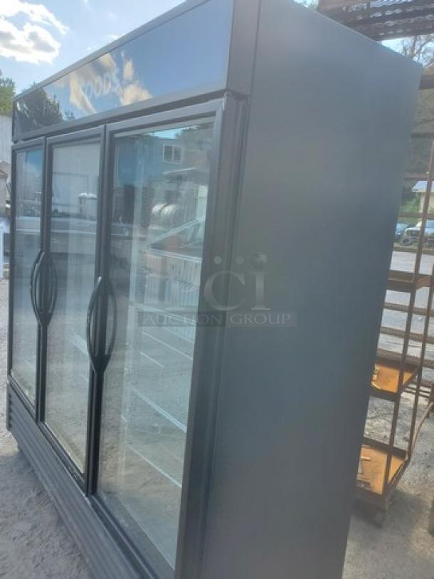 True GDM-72F-HC-TSL01 78" 3-section glass-door freezer. Features sleek black exterior, clear glass doors, and multiple shelves.