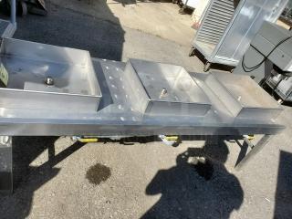 Stainless steel food warmer with three compartments and lids, designed for commercial use. Good condition.