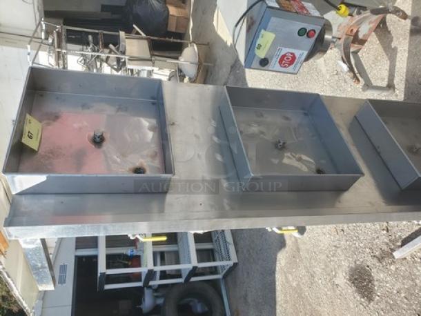 Industrial stainless steel equipment with multiple compartments. Features a control panel with stop button. Used condition.