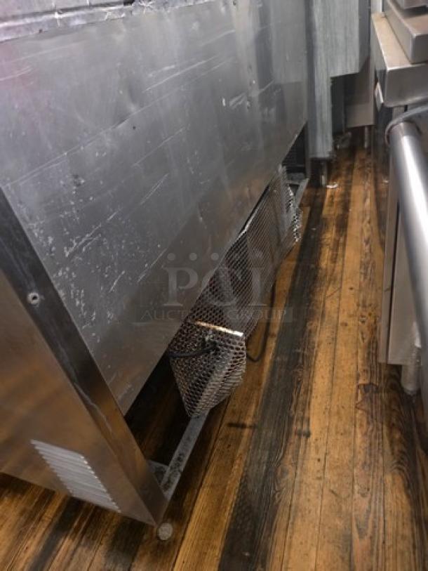 True QA-60-24M-B 60" Refrigerated Prep Table, stainless steel, 115V, used condition, visible wear on exterior.