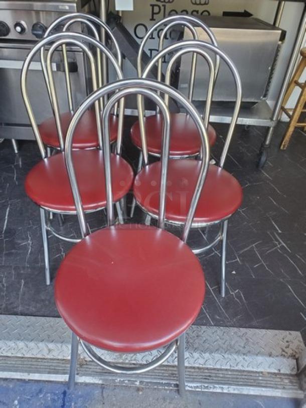 Lot of 4 red cushioned dining chairs with chrome frames. Used condition. Suitable for dining room or kitchen. (4XBID)
