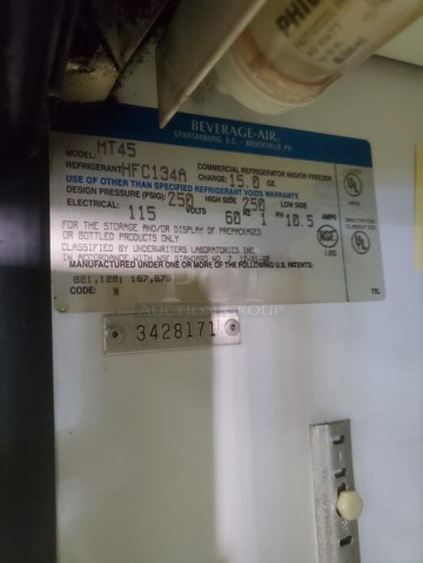 Beverage Air MT45 model label showing refrigerant type, pressure specs, and electrical details for slide door cooler.