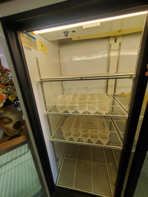 Beverage Air MT45 merchandiser refrigerator, two glass sliding doors, metal shelves, good condition, interior lit.