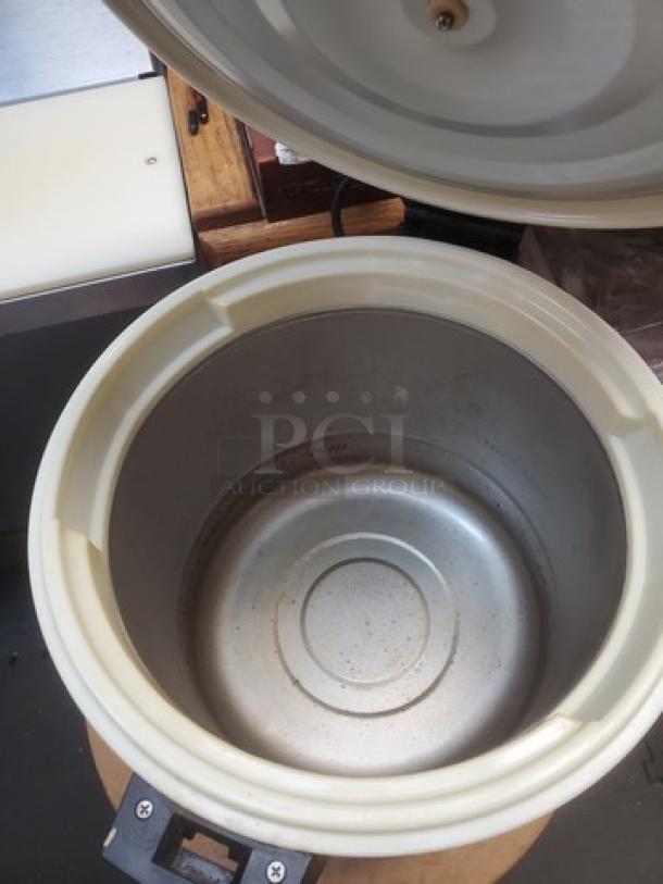 Excellante SEJ22000 commercial stainless-steel 50-cup rice warmer, open lid, clean interior, durable condition.