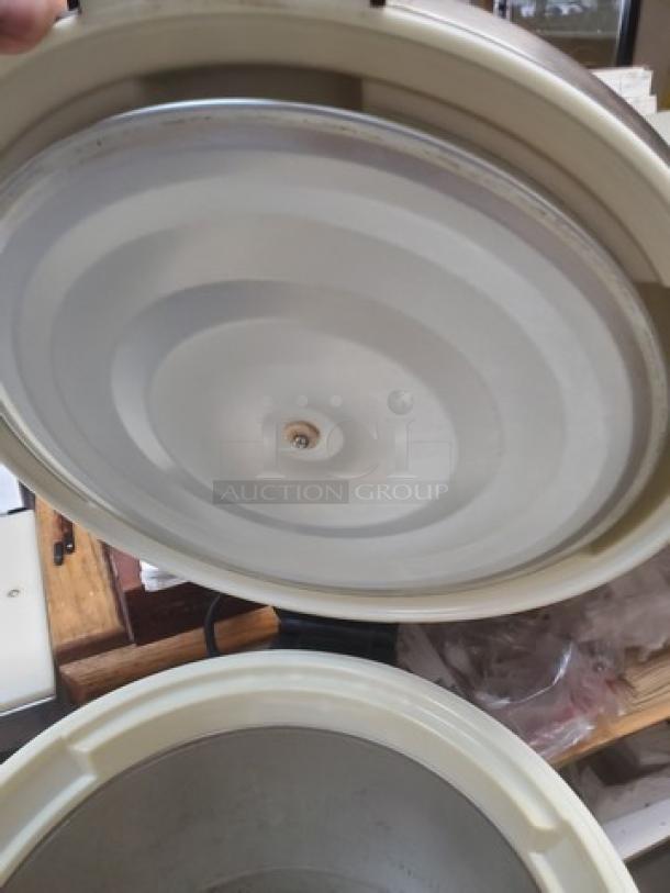 Excellante SEJ-22000 stainless-steel 50-cup rice warmer, open lid view, used condition, ideal for commercial use.