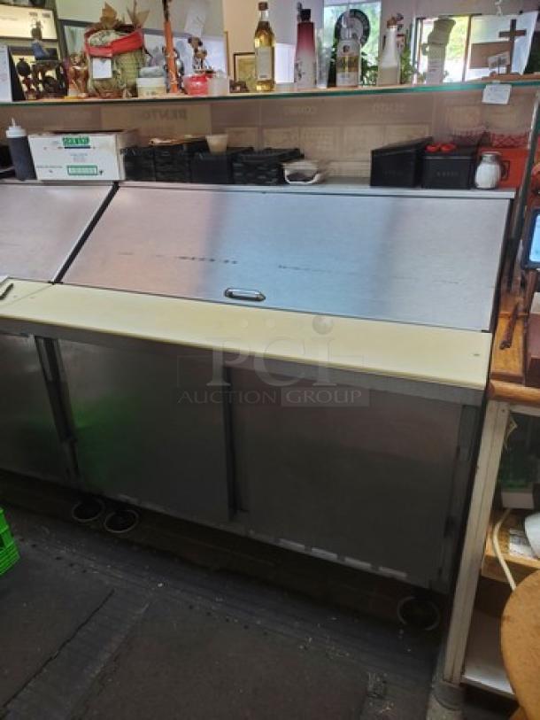 Beverage Air SUR48-18M 48" sandwich prep table, two-door model, in used condition. Contents not included.