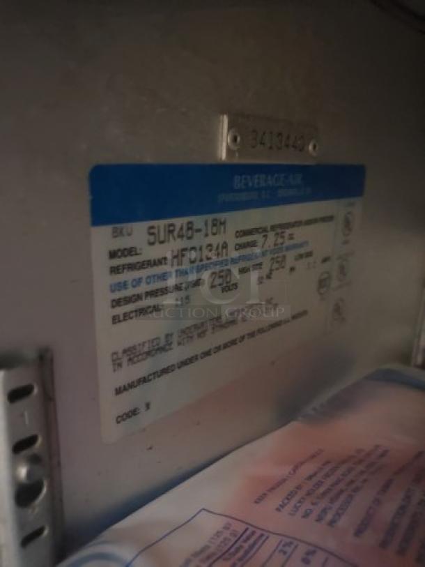 Beverage Air SUR48-18M label detailing model, refrigerant type HFC134A, and electrical requirements for sandwich prep table.