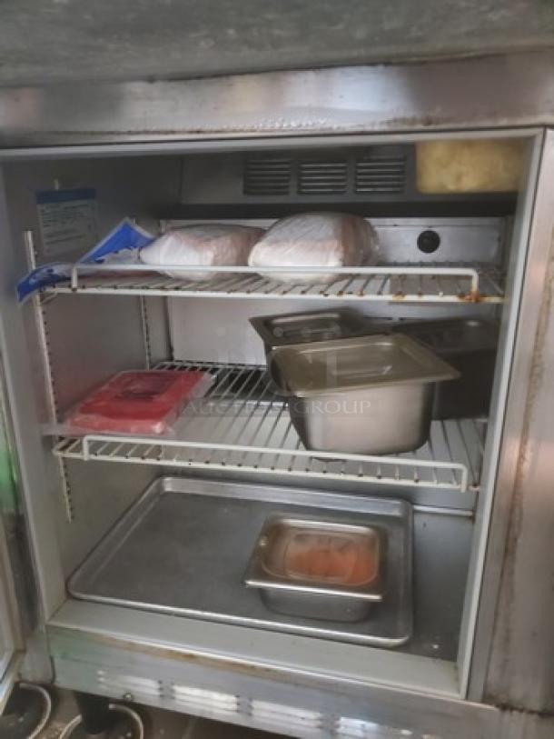 Beverage Air SUR48-18M, 48" sandwich prep table, two-door, showing interior shelves and storage space. Contents not included.