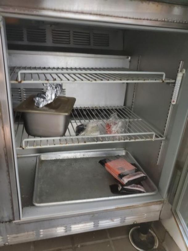Beverage Air SUR48-18M, 48" sandwich prep table, two-door, stainless steel, internal shelving, contents not included.