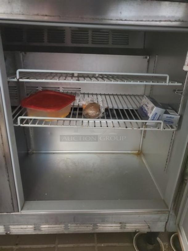 Beverage Air SUR48-18M 48" sandwich prep table, two-door model, shown with shelving inside. Contents not included.