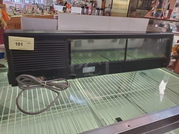 Hoshizaki HNC-120AA-R countertop refrigerated sushi display case, black, with glass sliding doors, in good condition.