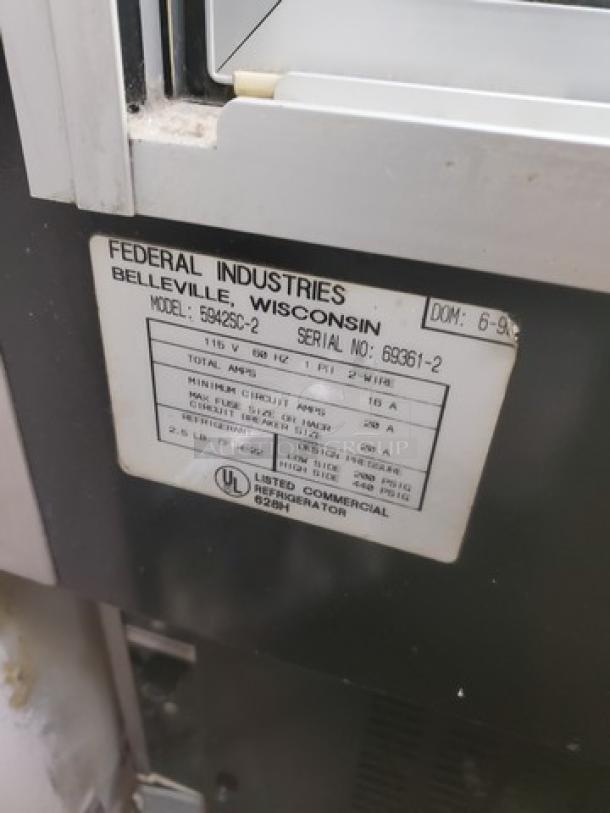 Federal Industries 5942SC-2, 59" flat glass refrigerated bakery display case, label close-up showing model and serial number.