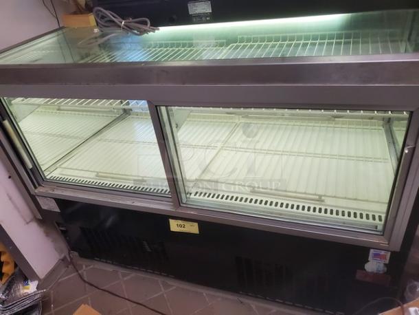 Federal Industries 5942SC-2, 59" flat glass refrigerated bakery display case, excellent condition, clear glass, white interior shelves.
