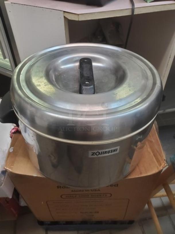Lot of 2 Zojirushi stainless steel thermal rice holders, non-electric, 25-cup capacity, insulated. Marked with Zojirushi logo.