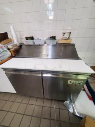 Avantco 178SCL2 48" sandwich prep table, stainless steel, dual doors, pristine condition, label visible on front. Contents not included.