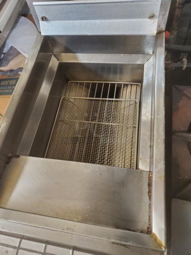Frymaster GF14SP gas fryer, 40 lb. capacity, stainless steel body, visible fryer basket, showing moderate use.