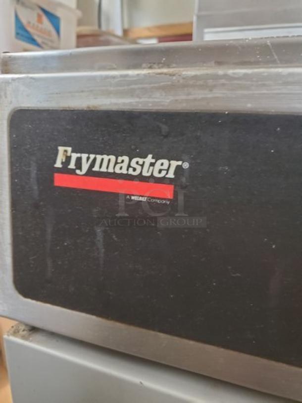 Frymaster GF14SP gas fryer, 40 lb. capacity, with brand logo visible. Used condition with slight wear.