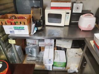 Stainless steel work table, durable, used condition, suitable for commercial kitchens. Contents not included.