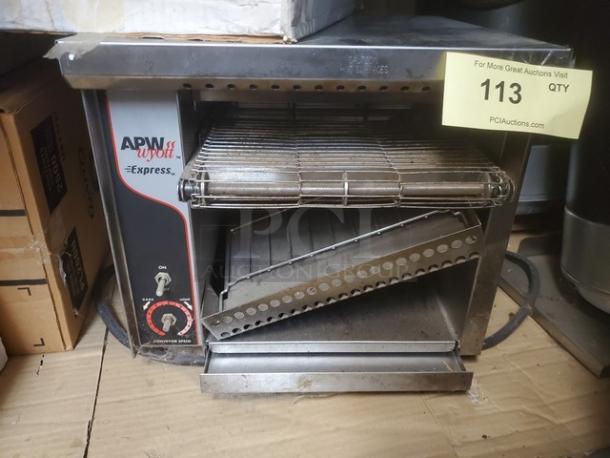 APW Wyott Express Countertop Conveyor Toaster, stainless steel, adjustable conveyor speed, used condition, model details visible.