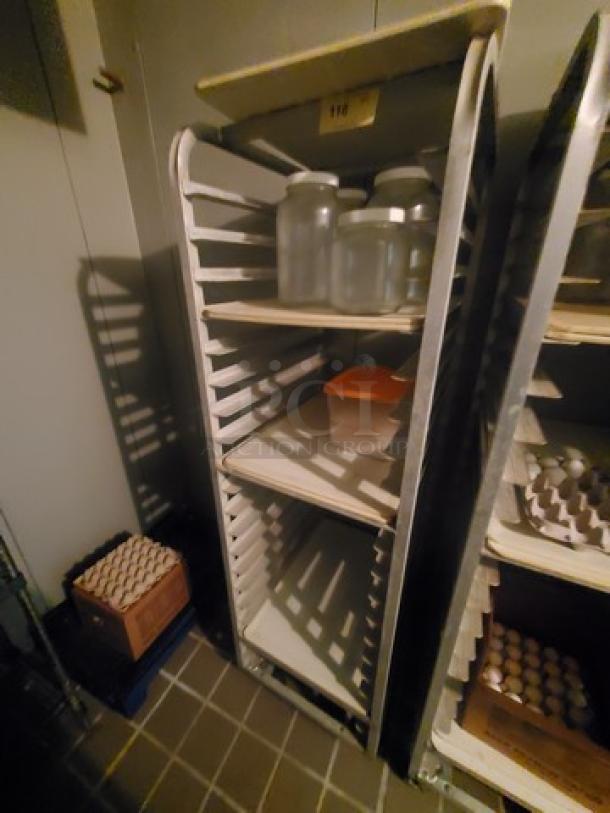 Sheet pan rack with multiple tiers, metal frame, used condition, labeled "118". Contents not included.
