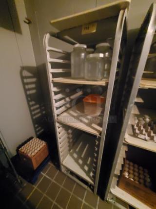 Sheet pan rack with multiple tiers, metal frame, used condition, labeled "118". Contents not included.