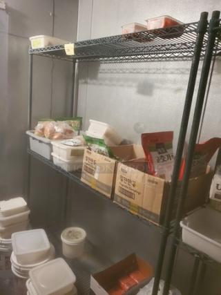 3-Tier Wire Shelving Unit, black metal, adjustable shelves, durable construction, ideal for storage. Contents not included.