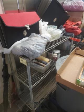 Lot of 3 small wire shelves, used condition, stacked with assorted items. Ideal for storage, lightweight metal construction.