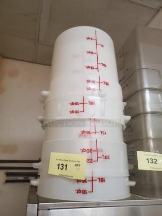 Lot of 4 white food storage containers with red measurement markings, stamped with "4XBID." Clear condition, auction tag visible.