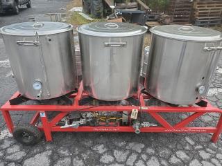 The Alpha Ruby 1 Barrel Brew System with 3 stainless steel pots on red frame, gas or propane compatible, includes 8 kegs.