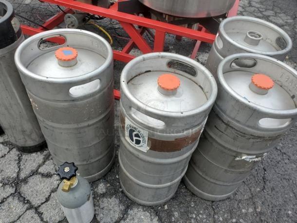 The Alpha Ruby 1 Barrel Brew System with 8 kegs, gas or propane compatible, visible on asphalt surface. Pick up only.