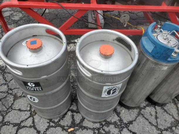 The Alpha Ruby 1 Barrel Brew System with 8 stainless steel kegs, gas and propane compatible. Visible Ranch Coffee branding. Pick up only.