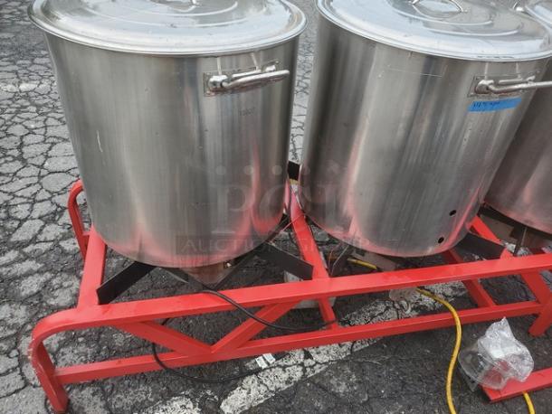 The Alpha Ruby 1 Barrel Brew System, stainless steel, red frame, gas/propane compatible, includes 8 kegs. Pickup only.