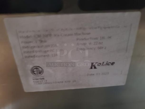Kolice ICM 200P ice cream machine label showing production rate of 18L/H, 22oz amount, 110V voltage, and March 2023 date.
