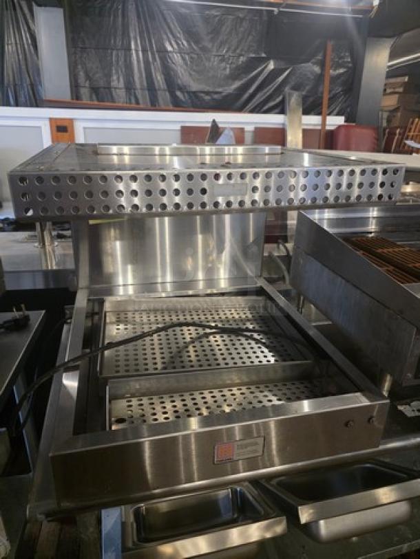 Marshall Air Systems RR5-26-IM fried food dump station with stainless steel body and perforated tray. Excellent condition.
